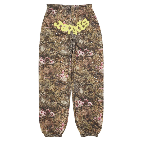 Camouflage pants with floral patterns and yellow text on a white background