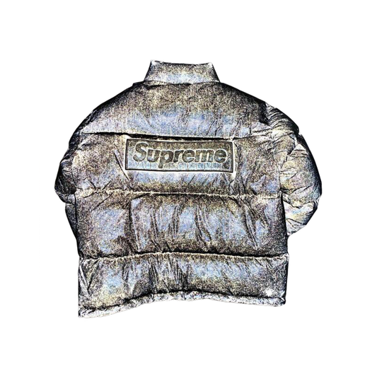 Silver puffer jacket with Supreme logo on a white background