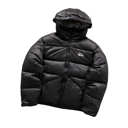 Black puffer jacket with a brand logo on a white background